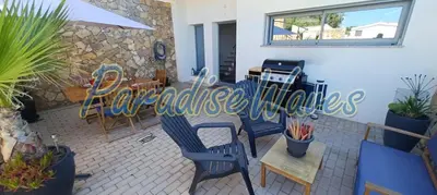 a restaurant with blue chairs and a sign that reads excellencekies at Maison avec piscine et jacuzzi in Guia