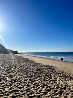 a view of a beach with footprints in the sand at Maria Luisa Beach -Amaral's Guesthouses in Albufeira