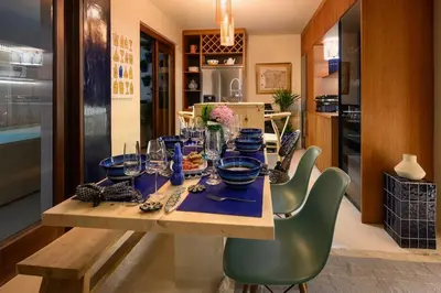 a bedroom with two bunk beds and a wooden door at Maria Luisa Beach -Amaral's Guesthouses in Albufeira