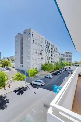 a view of a city street with a tall building at Spacious 2 bedroom apartment in Faro in Faro