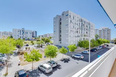 an aerial view of a parking lot in a city at Spacious 2 bedroom apartment in Faro in Faro