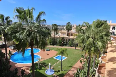 an aerial view of a resort with palm trees at Los Arcos 3 - Pool & Vilamoura Center in Vilamoura