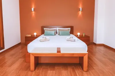 a bedroom with a bed with two pillows on it at Villa Maya Bay by Algarve Vacation in Guia