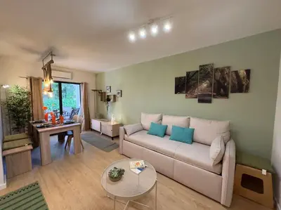 a living room with a couch and a table at Balaia Golf Village apt 105 in Albufeira