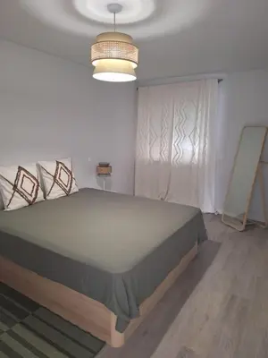 a bedroom with a large bed in a room at Apartment Center View in Faro