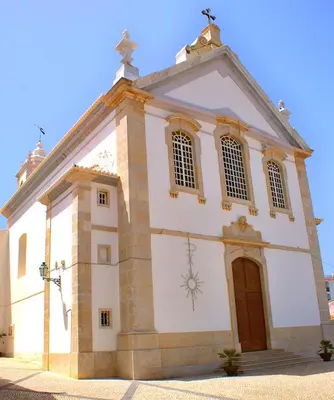a large white church with a clock on it at Luxury 1 Bedroom Apartment, Marina de Albufeira in Albufeira