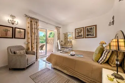 a living room with two couches and a table at 4 Bedrooms Private Pool Close To All Amenities in Quarteira