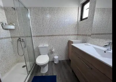 a bathroom with a toilet and a shower and a sink at Sea View One Bedroom with Swimming Pool Ponce 282 in Albufeira