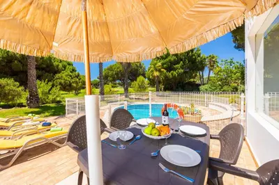 a living room with a couch and a fireplace at Villa Mexico in Quarteira