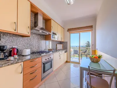 a living room with a couch and a tv at Apartment Vista Mar by Interhome in Albufeira