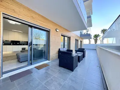 a living room with couches and chairs in a house at Faro Prestige by Homing in Faro
