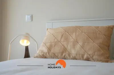 a bedroom with a bed with a pillow and a lamp at #233 Fox Trail by Home Holidays in Albufeira