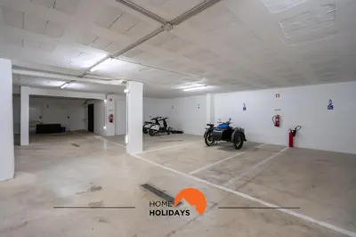 a garage with a motorcycle parked in it at #233 Fox Trail by Home Holidays in Albufeira