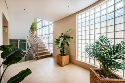 a hallway with plants and stairs in a building at Capetown Marina Luxury Villa - Private Pool in Albufeira