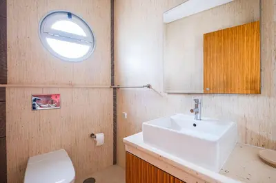 a bathroom with a sink and a mirror and a toilet at Capetown Marina Luxury Villa - Private Pool in Albufeira