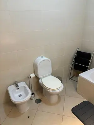 a bathroom with a toilet and a sink at Albufeira Appartement avec piscine in Albufeira