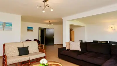 a living room with a couch and a chair at Villa Lotus, CD 283 - Cleverdetails in Vilamoura
