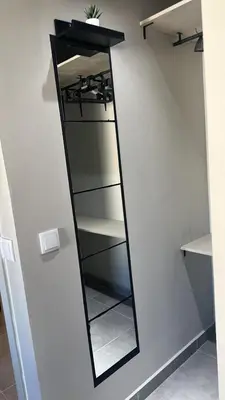 a mirror on a wall in a room at Vilamoura in Quarteira