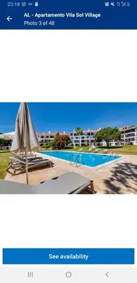 a screenshot of a website with a pool and an umbrella at Casa Joanna Vila Sol Golf Village in Quarteira