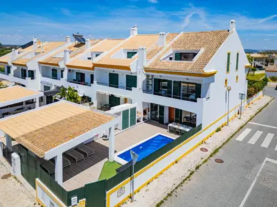 an aerial view of a house with a swimming pool at Villa Gil in Albufeira