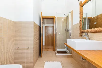 a bathroom with a sink and a toilet and a shower at Villa Oliva - Maison 6 chambres in Vilamoura