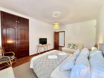a living room with a bed and a couch at Vilamoura White House Villa With Pool by Homing in Vilamoura