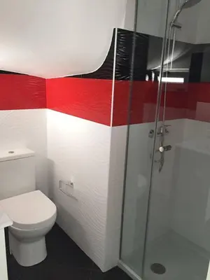 a red and white bathroom with a toilet and a shower at Casa com 3 suites, jacuzzi , en Albufeira in Albufeira