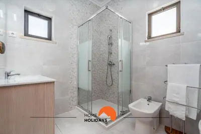 a bathroom with a shower and a toilet and a sink at #232 Vila Girasol 33 by Home Holidays in Albufeira