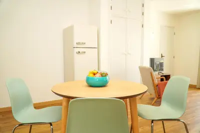 a bowl of fruit on a wooden table in a room at Pilar Apartment in Albufeira