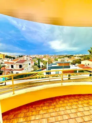 a view of a city from a balcony at Casa do Mar Faro in Faro
