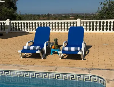 a laundry room with a table and a washing machine at BnB Homes Luxurious Villa Stardust with Swimming pool & BBQ for Family Fun in Ameijoafas