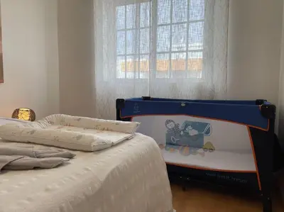 a bedroom with a bed and a window at The Luna Apartment Faro - 2 Bedroom Private Apartment in Faro