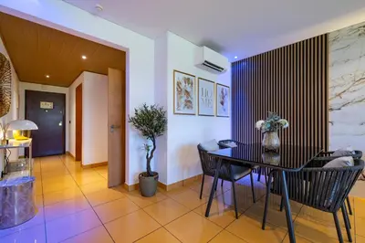 a dining room with a table and chairs at Romantic with private Hot Tub & Parking - big pool - Marina access in Albufeira