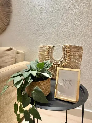 a table with a picture and a basket on it at Apartamentos do Atlantico in Albufeira