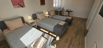 an overhead view of a room with three beds at Ideal Bubble House in Faro