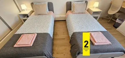 two beds sitting next to each other in a room at Ideal Bubble House in Faro