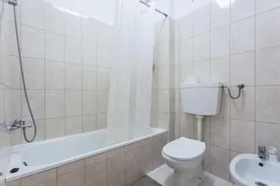 a bathroom with a toilet and a shower and a sink at Color me Happy - 2 bedrooms apartment near Forum Algarve in Faro
