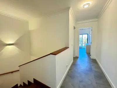 an empty hallway with a staircase in a house at Casa Coral Azul in Albufeira