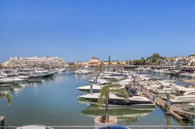 a bunch of boats parked in a marina at T2 duplex na Marina de Vilamoura in Loulé