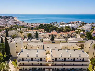an aerial view of a city with buildings and the ocean at white T1 - Ocean View in Albufeira