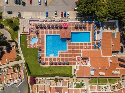 an overhead view of a building with a swimming pool at white T1 - Ocean View in Albufeira