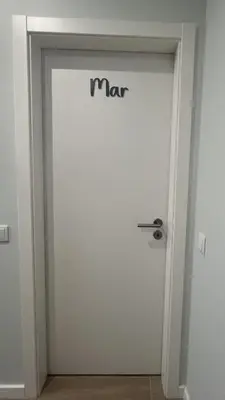 a door with the word man written on it at Casa MarRia in Faro