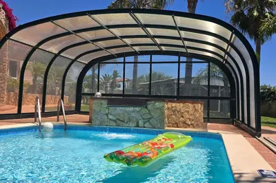 a pool with an inflatable raft in a swimming pool at Villa Ania - Private Villa with pool&Jacuzzi, 16 to 40 pax in Albufeira