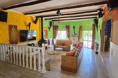 a living room with a couch and a tv at Villa Ania - Private Villa with pool&Jacuzzi, 16 to 40 pax in Albufeira