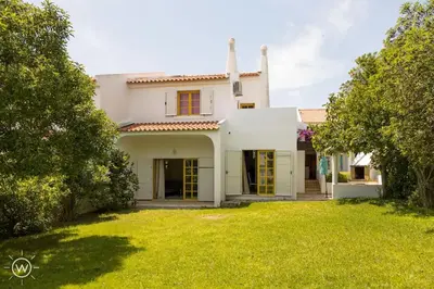 a living room with a large couch and a table at Da Vinci Villa Salgados-Guia-Algarve in Albufeira