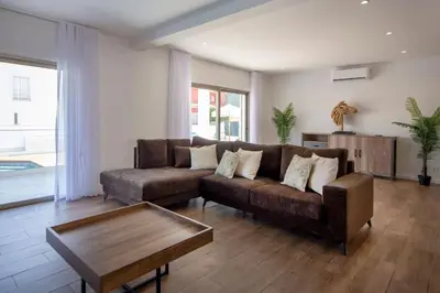 a living room with a couch and a coffee table at Krystal Bay Villa in Albufeira