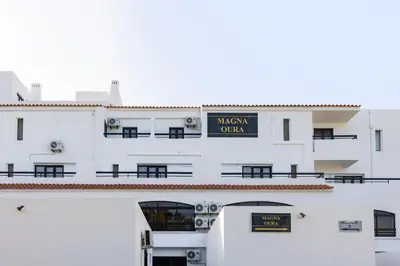 a white building with a sign that reads museum oulum at Magna Oura in Albufeira