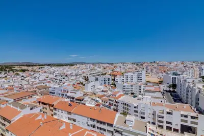an aerial view of a city with buildings at 2bdr Sea View Miravila Apartment in Quarteira in Quarteira