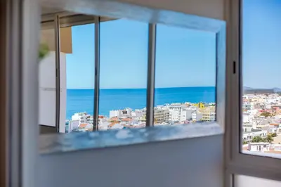 a view of the ocean from a window at 2bdr Sea View Miravila Apartment in Quarteira in Quarteira