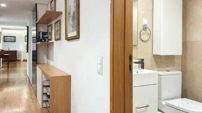 a bathroom with a toilet and a sink at Refúgio Sereno Vilamoura T2 by HsR Vilamarina in Quarteira